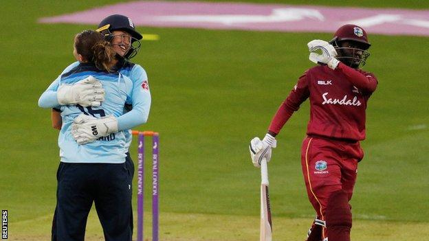 England's Kate Cross and Sarah Taylor celebrate the wicket of West Indies' Kycia Knight