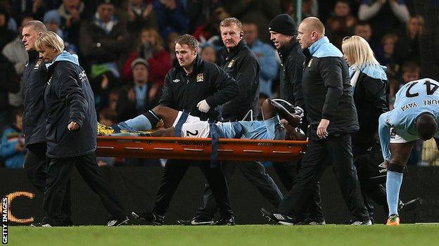 Micah Richards is carried off after injuring his knee vs Swansea in 2012