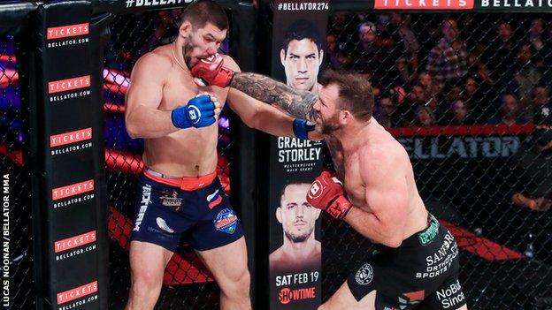 Ryan Bader punches his opponent