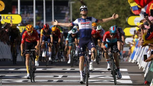 Kasper Asgreen celebrates winning stage 18 of the 2023 Tour de France