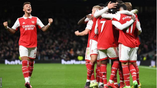 Arsenal celebrate after scoring against Tottenham