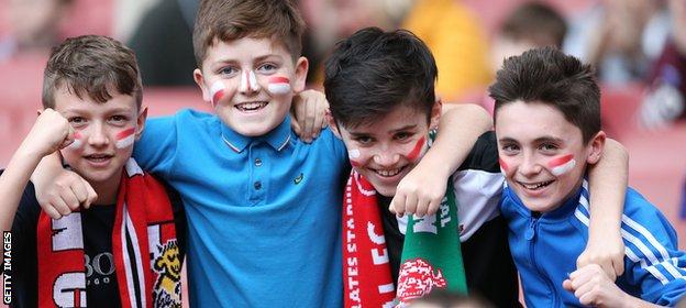 Young FA Cup fans enjoying match day atmosphere