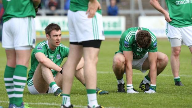 Fermanagh players Conall Jones and Eoin Donnelly show their disappointment after the final whistle