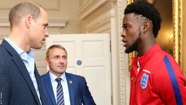 Paul Simpson with Prince William and Josh Onomah in 2017
