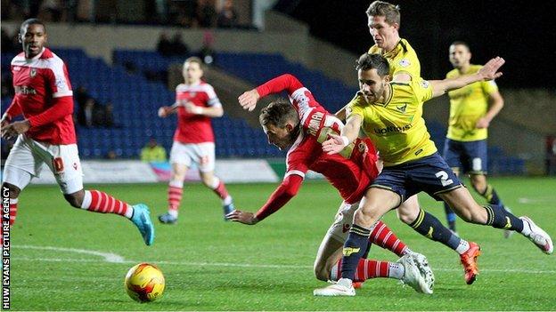 Alex Rodman is fouled by an Oxford defender