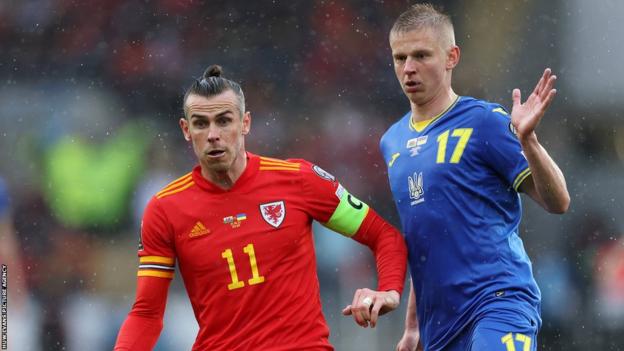 Ukraine's Oleksandr Zinchenko (right) challenges Gareth Bale of Wales