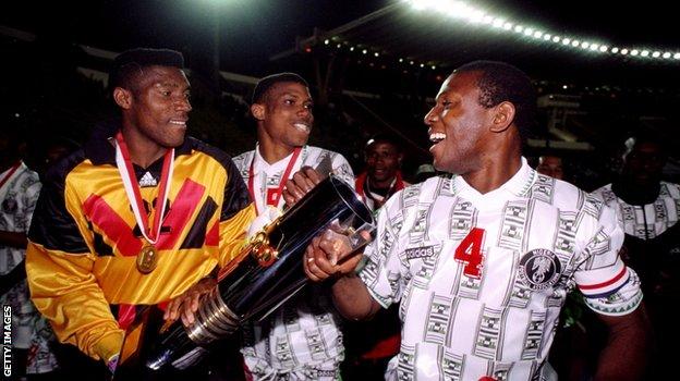 Keshi (right) celebrates with the African Nations Cup trophy after victory over Zambia