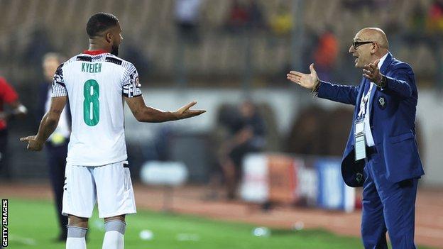 Ghana's Daniel-Kofi Kyereh (left) argues with Gabon coach Patrice Neveu