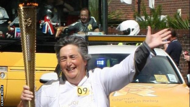 Claire Moyle carries the London 2012 Olympic torch