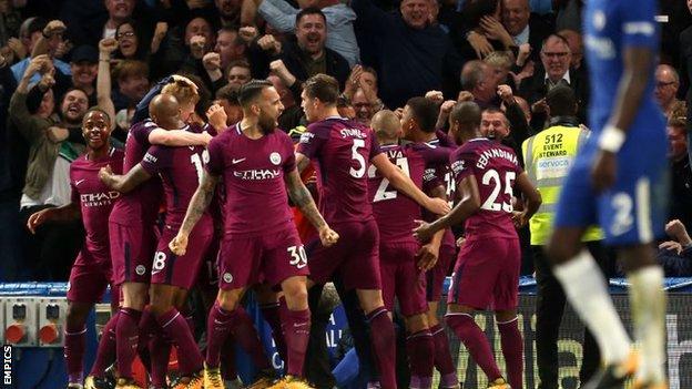 Manchester City celebrate scoring at Chelsea