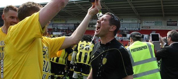 Nigel Clough gets covered in champagne