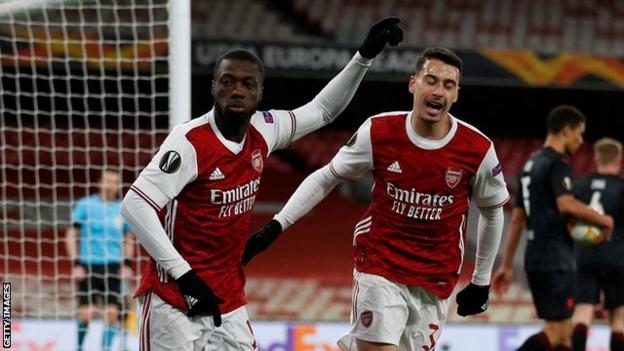 Arsenal's players celebrate scoring against Slavia Prague in the Europa League