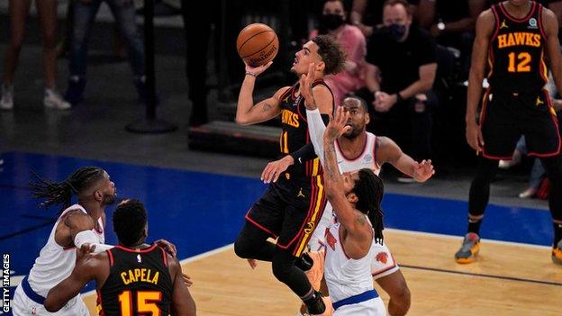 The Atlanta Hawks' Trae Young shoots against the New York Knicks in their NBA play-off