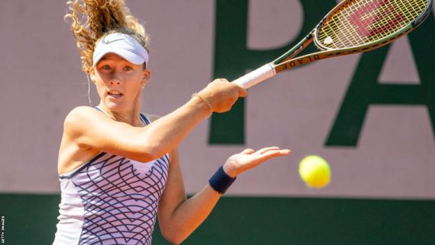 Mirra Andreeva hits a return in her French Open first-round match