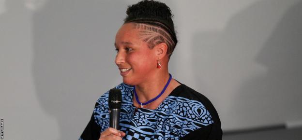 Shaunagh Brown speaks into a microphone