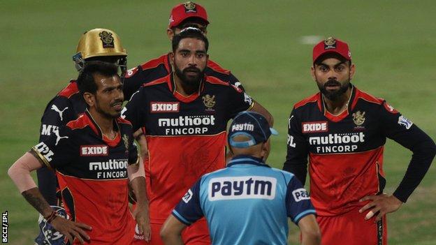 Royal Challengers Bangalore captain Virat Kohli (right) complains to the umpire about a decision