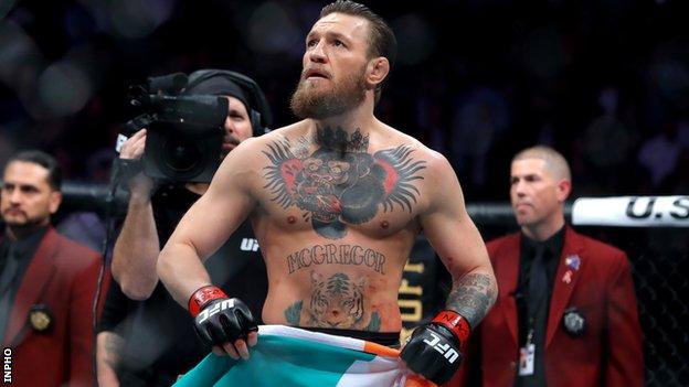 Conor McGregor has the Irish flag in the hands after his win over Donald Cerrone in January