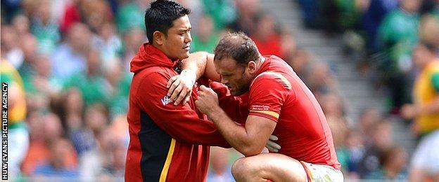 Jamie Roberts is treated during Wales' 16-10 win in Ireland