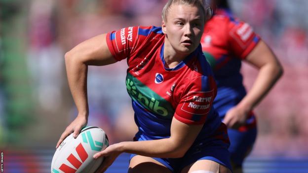 Georgia Roche carrying the ball for Newcastle Knights