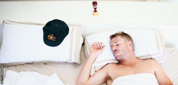 David Warner in bed with his baggy green and the Ashes urn