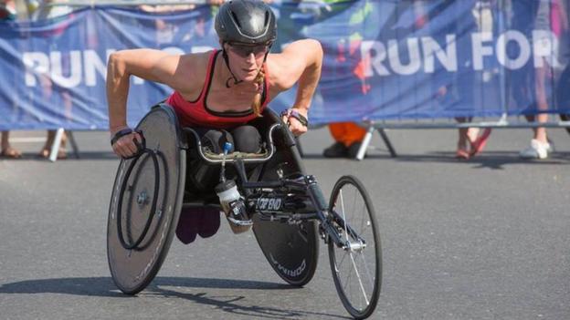 Lizzie competing in a race chair