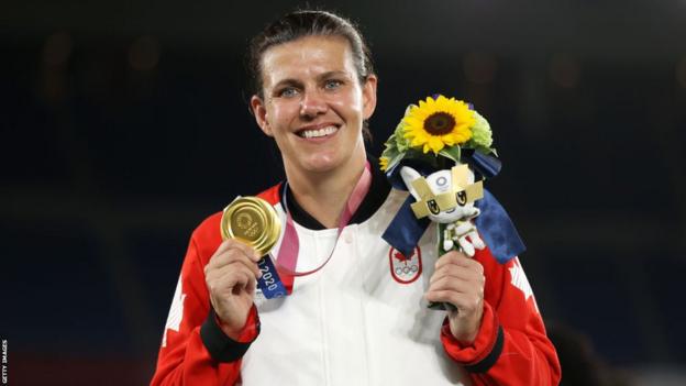 Christine Sinclair with her gold medal from the Tokyo 2020 Olympics