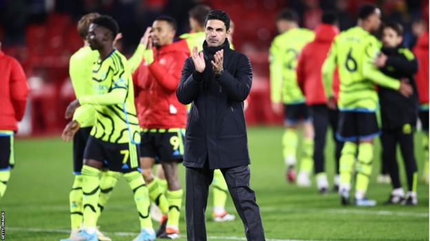Arsenal manager Mikel Arteta applauds the away fans at The City Ground