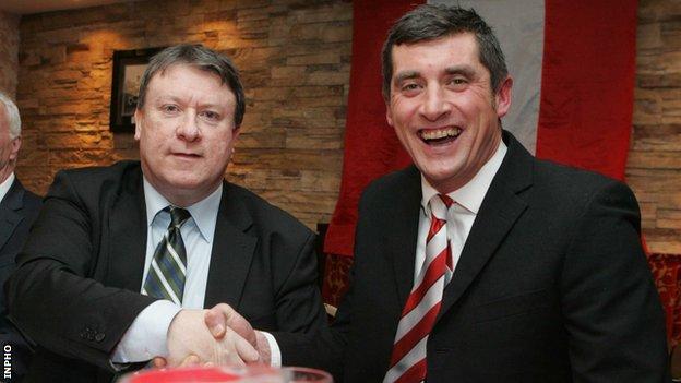 Happier times as Derry City chairman Philip O'Doherty shakes hands after Devine was appointed to his first spell as Candystripes boss in 2012