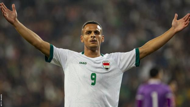 Ali Al-Hamadi celebrates scoring for Iraq