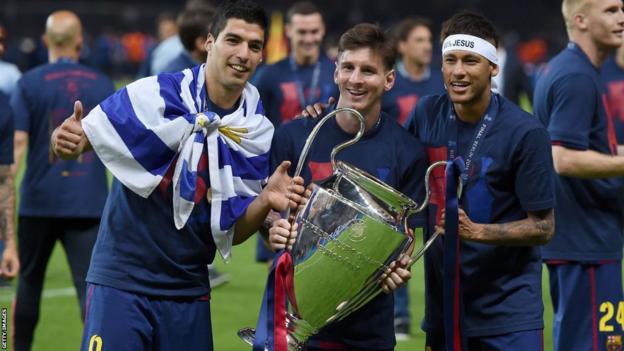 Luis Suarez, Lionel Messi and Neymar pose with the Champions League trophy
