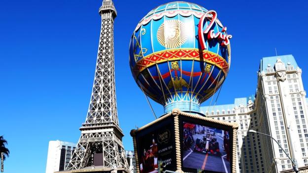 A big screen at Paris Las Vegas shows Formula 1 cars racing