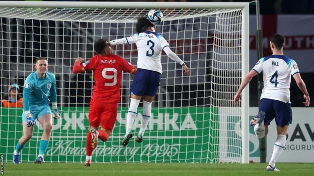 Nico Lewis catches North Madeconia forward in the penalty area