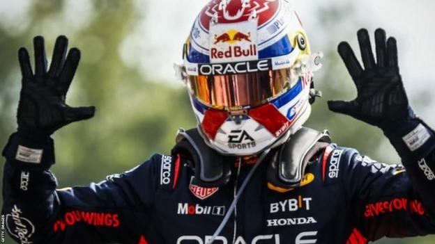 Max Verstappen holds up both his hands to show 10 digits after winning the Italian Grand Prix