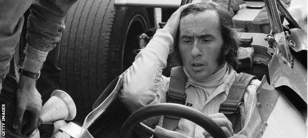 Jackie Stewart sits in his Matra car before the race at Silverstone, 1969.