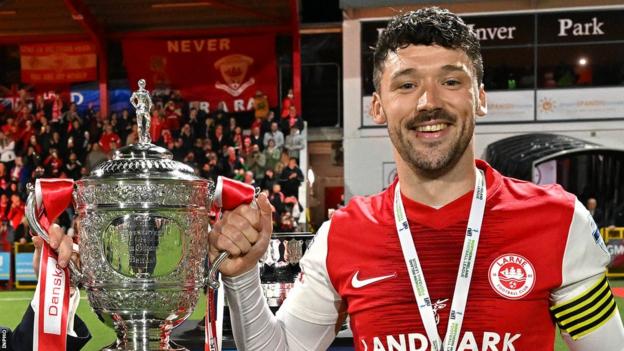 Tomas Cosgrove pictured with the Gibson Cup which was presented to Larne following their maiden Irish Cup success