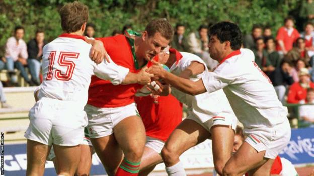 Gareth Llewellyn runs through the Portugal defence