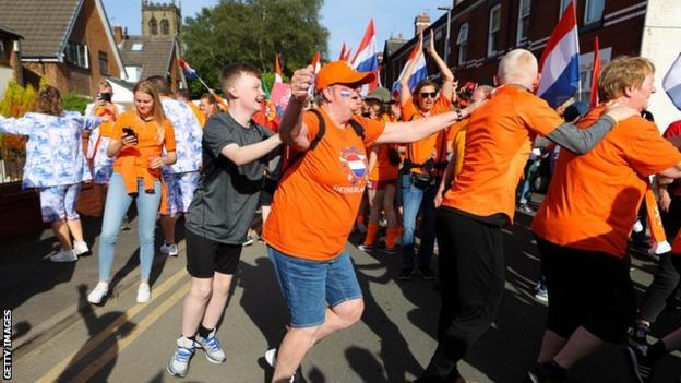 Netherlands fans - and locals - dancing on Schofield Street, Leigh, before the Euro 2022 game with Portugal
