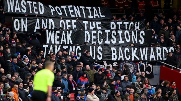 Crystal Palace fans display a banner towards the end of the game at Arsenal