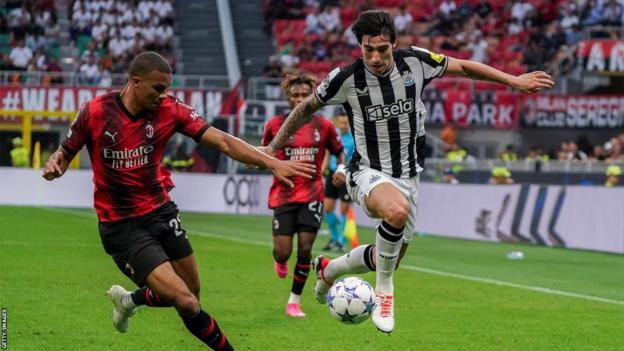 Sandro Tonali controls the ball for Newcastle United against AC Milan in the Uefa Champions League