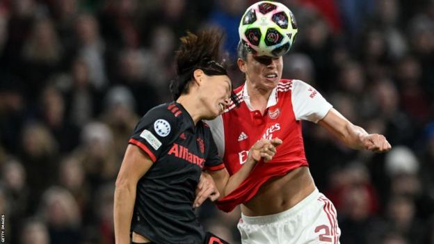 Rafaelle Souze and Saki Kumagai battle for the ball in the Bayern box