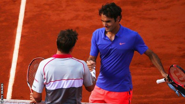 Roger Federer shakes hands with Stan Wawrinka after being beaten in the last eight in 2015