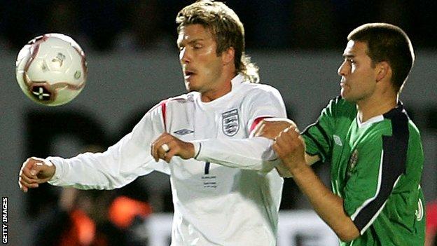 England's David Beckham in action against David Healy of Northern Ireland