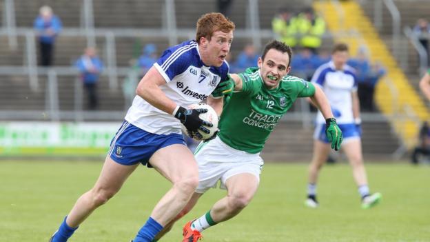 Kieran Duffy carries the ball for Monaghan as Paul McCusker attempts to gain possession for the Erne county