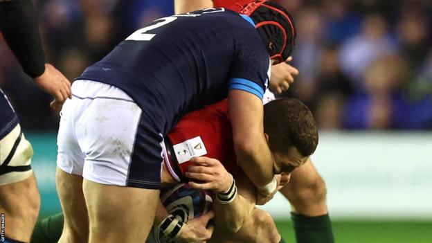 George North takes a high tackle from George Turner at Murrayfield