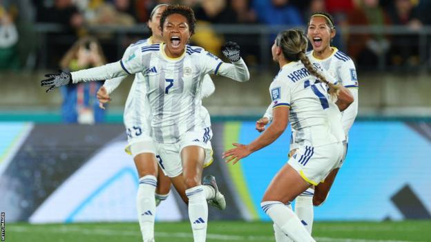 Philippines players observe  scoring against New Zealand