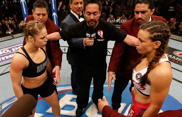 Ronda Rousey and Miesha Tate in the octagon