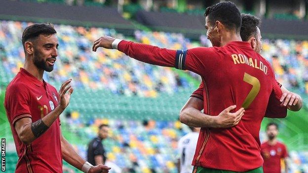 Cristiano Ronaldo (right) celebrates his goal with Bruno Fernandes