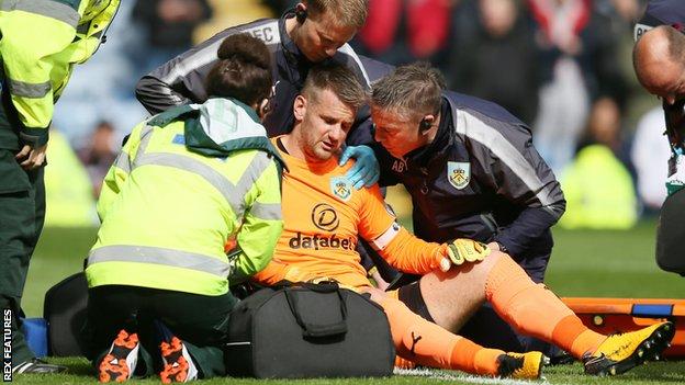 Tom Heaton receives treatment