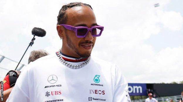 Lewis Hamilton wearing earrings