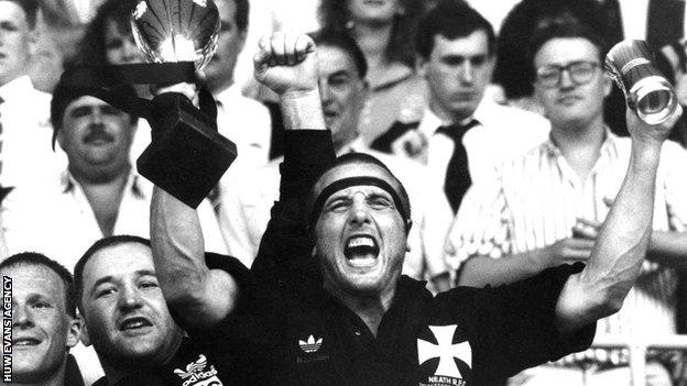 Neath captain Kevin Phillips lifts the Schweppes Cup in 1990
